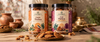 Coming soon: two Aamriti jars labelled Classic Thekua and Gud Thekua with thekua on a plate